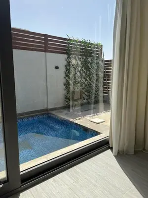 a view of a swimming pool through a window at 2BR Twin House With Private Heated Pool at El-Gouna -Seperate 1Bedroom & Seperate Guest studio- in Hurghada