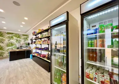 a refrigerator filled with lots of drinks in a store at Luxury 95m Penthouse - Boutique Resort & Wifi in Hurghada