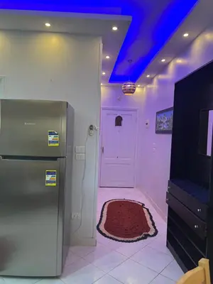 a kitchen with a refrigerator and a purple ceiling at Paradise Hill Compound in Hurghada