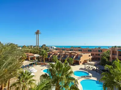 an aerial view of the resort with palm trees and the ocean at Club Paradisio El Gouna Red Sea in Hurghada