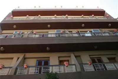 a building with balconies on top of it at Fontana Hostel luxor in Luxor