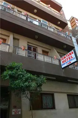 a building with a sign for a hotel at Fontana Hostel luxor in Luxor