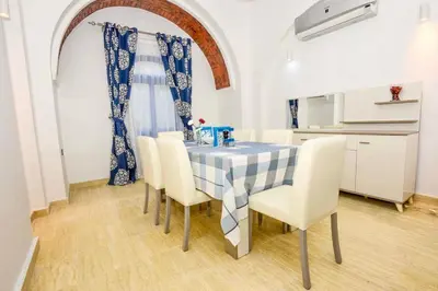 a dining room with a table and chairs at Luxury 8BR Villa with seaview and private pool in Hurghada in Hurghada