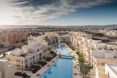 an aerial view of a city with buildings at Boho Mint 1 BDR Mangroovy Pool & Sea View in Hurghada