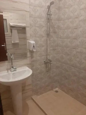 a bathroom with a sink and a shower at La Casa Beach in Hurghada
