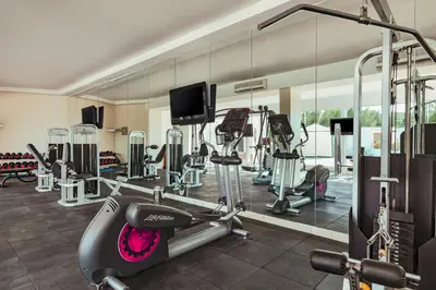 a gym with tread machines and a treadmill at Sunrise Alma Bay Resort in Hurghada