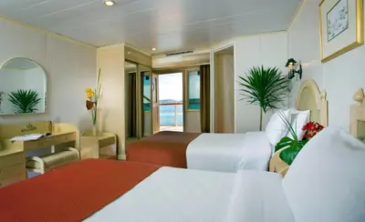 a hotel room with two beds and a desk at Mövenpick Prince Abbas Lake Nasser Cruise, Every Monday Four Nights From Aswan, Every Friday Three nights From Abu-Simbel - Including Excursions and Sightseeing in Aswan