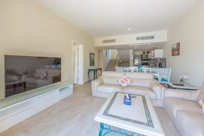a living room with a couch and a table at Joubal Lagoon II 4-Bedroom Villa with Private Pool & Lagoon Views in Hurghada