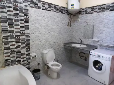 a bathroom with a toilet and a sink at Villa Victoria Old Nile View in Luxor
