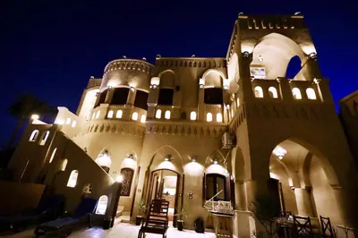 a large building with lights on it at night at Villa Nur in Luxor