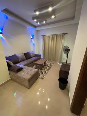 a living room with a couch and a table at MARINA SKY in Hurghada