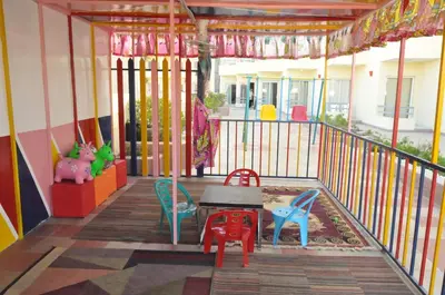 a porch with chairs and a table on a balcony at Dexon Roma Hotel in Hurghada