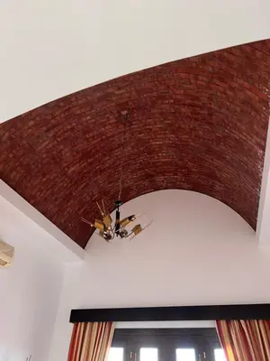 a brick ceiling with a chandelier hanging from it at South Marina Apartment Wi-Fi available in Hurghada