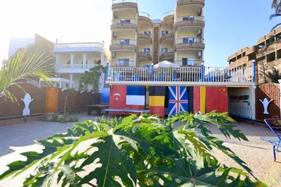 a building with a flag painted on the side of it at Blue Nile House in Luxor