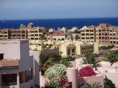 a view of a city with white buildings and flowers at Florenza - sea view in Hurghada