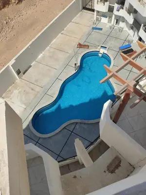 an overhead view of a swimming pool under construction at Fully furnished Studio, At Tiba View, NUMBER R75 in Hurghada