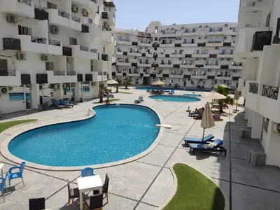 an overhead view of a swimming pool in a building at Fully furnished Studio, At Tiba View, NUMBER R75 in Hurghada