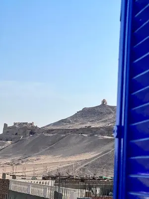 a view of a hill with a building on it at Ghalia Guest House in Aswan