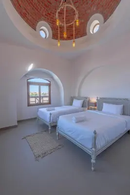 two beds in a white room with a ceiling at Fresh Breeze High-End 2BR Villa with Private Pool, Sabina, El Gouna in Hurghada