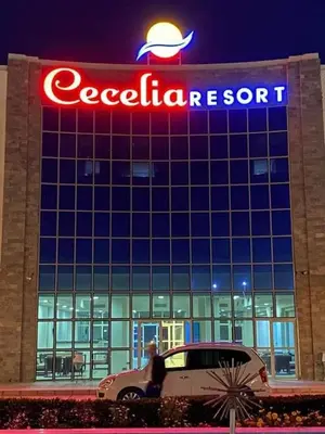 a car parked in front of a car dealership at منتجع سيسيليا cecelia resort in Hurghada