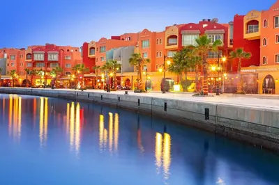 a city with a river with buildings and palm trees at Outstanding Apartment with Marina Hurghada view in Hurghada