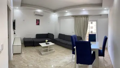 a living room with a couch and a table at selena bay in Hurghada