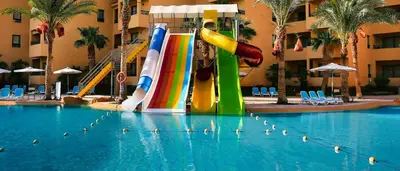 a pool with a water slide in a resort at New Eagles Downtown Zahabia Resort & Aqua Park in Hurghada