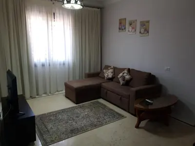 a living room with a couch and a table at Tawaya sahl hashesh in Hurghada