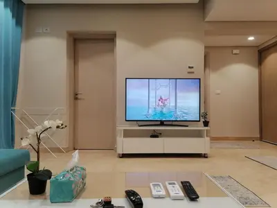 a living room with a large flat screen tv at Mangarovy El Gouna in Hurghada