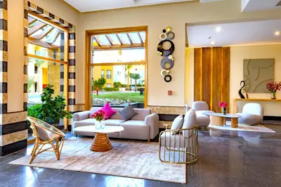 a living room with a couch and chairs at AJIRA Resort Sahl Hasheesh in Hurghada