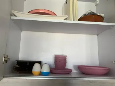 a shelf with bowls and vases on it at Elgouna Hurghada egypt mangroovy in Hurghada