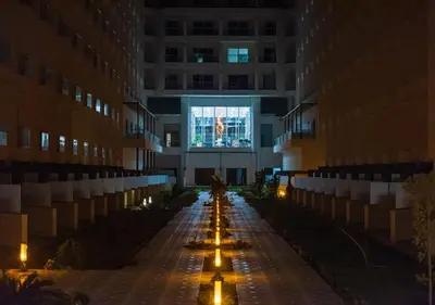 an empty hallway of a building at night at The Comfortable palace in Hurghada