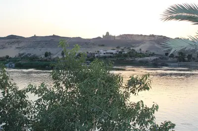 a house in the middle of a body of water at Nile View Guest House in Aswan