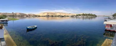 a small boat sitting in the middle of a lake at Nile View Guest House in Aswan