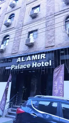 a car parked in front of a palace hotel at Al Amir Palace Hotel in Suwhaj