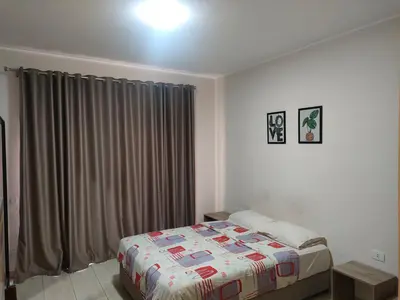 a bedroom with a bed and a window with curtains at Aldau Heights lovely studio in Hurghada