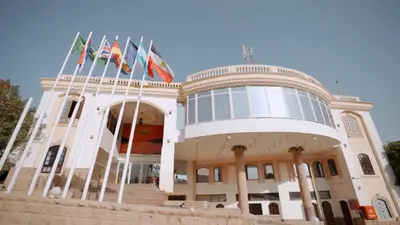 a building with flags on top of it at New Sunset Resort in Aswan