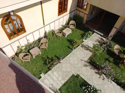 an overhead view of a patio with chairs and flowers at Mikhaila Guest House in Luxor
