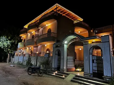 a building with a bike parked in front of it at Mikhaila Guest House in Luxor