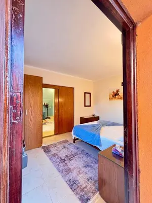 a bedroom with a bed and a table in it at Snorkeling Paradise 5 Star Resort Stella Makadi in Hurghada
