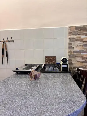 a kitchen with a stove and a counter top at Snorkeling Paradise 5 Star Resort Stella Makadi in Hurghada