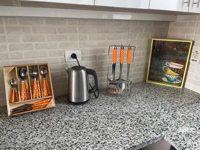 a counter top with a coffee pot and utensils at Luxury 3BR Townhouse, Tawila, El Gouna, Lagoon & Pool access in Hurghada