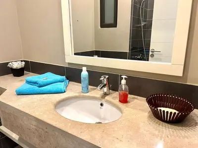 a bathroom counter with a sink and a mirror at Luxury 3BR Townhouse, Tawila, El Gouna, Lagoon & Pool access in Hurghada