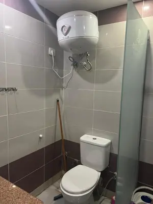 a small bathroom with a toilet and a sink at Cecelia resort in Hurghada