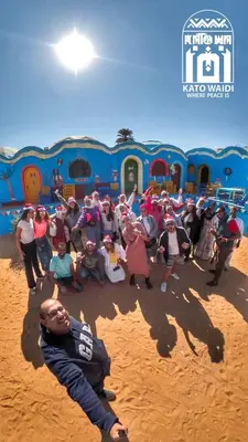 a group of people posing in front of a playground at Kato Waidi Nubian Resort in Aswan