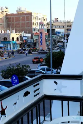 a view of a parking lot with cars in a city at Lamera Hotel in Hurghada