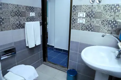 a bathroom with a sink and a shower at Lamera Hotel in Hurghada