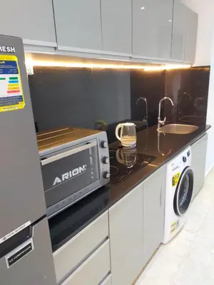 a kitchen with a microwave and a sink at Red Sea Panorama in Hurghada