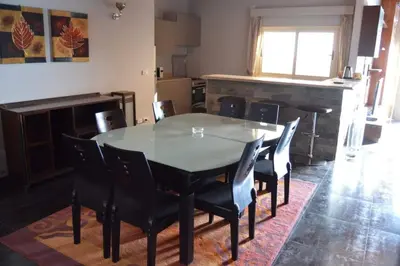 a dining room with a table and chairs at Askyhomes in Hurghada