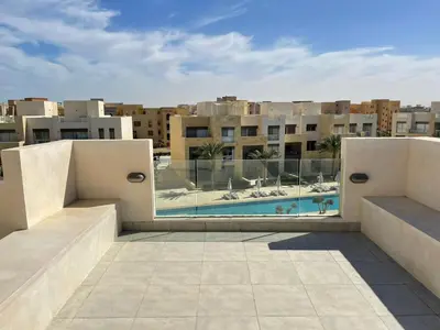 a view from the roof of a building with a swimming pool at Babel Apartments el gouna in Hurghada